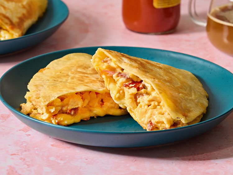 A plate with two quesadillas inside one on top of the other